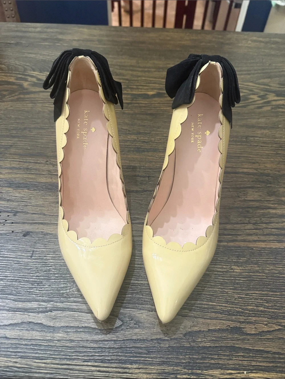 kate spade Yellow Patent Leather Pointed Toe Pumps with Black Bow Accent